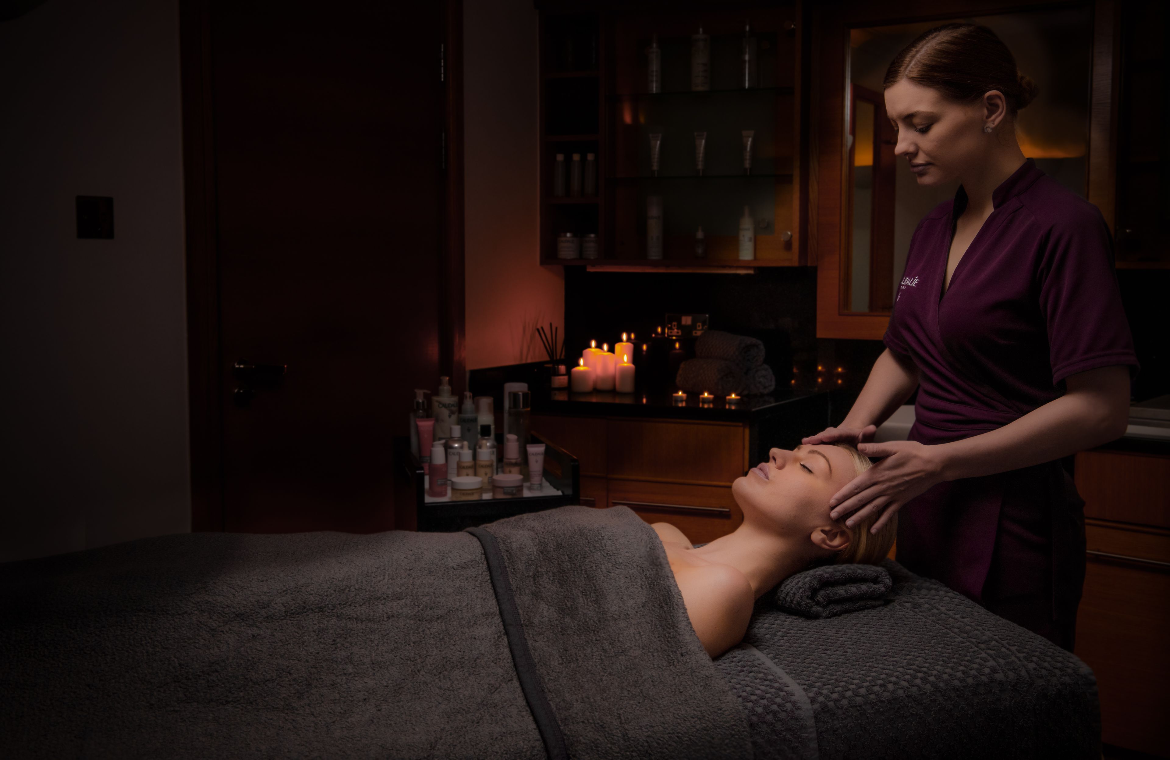 A lady receiving a head massage