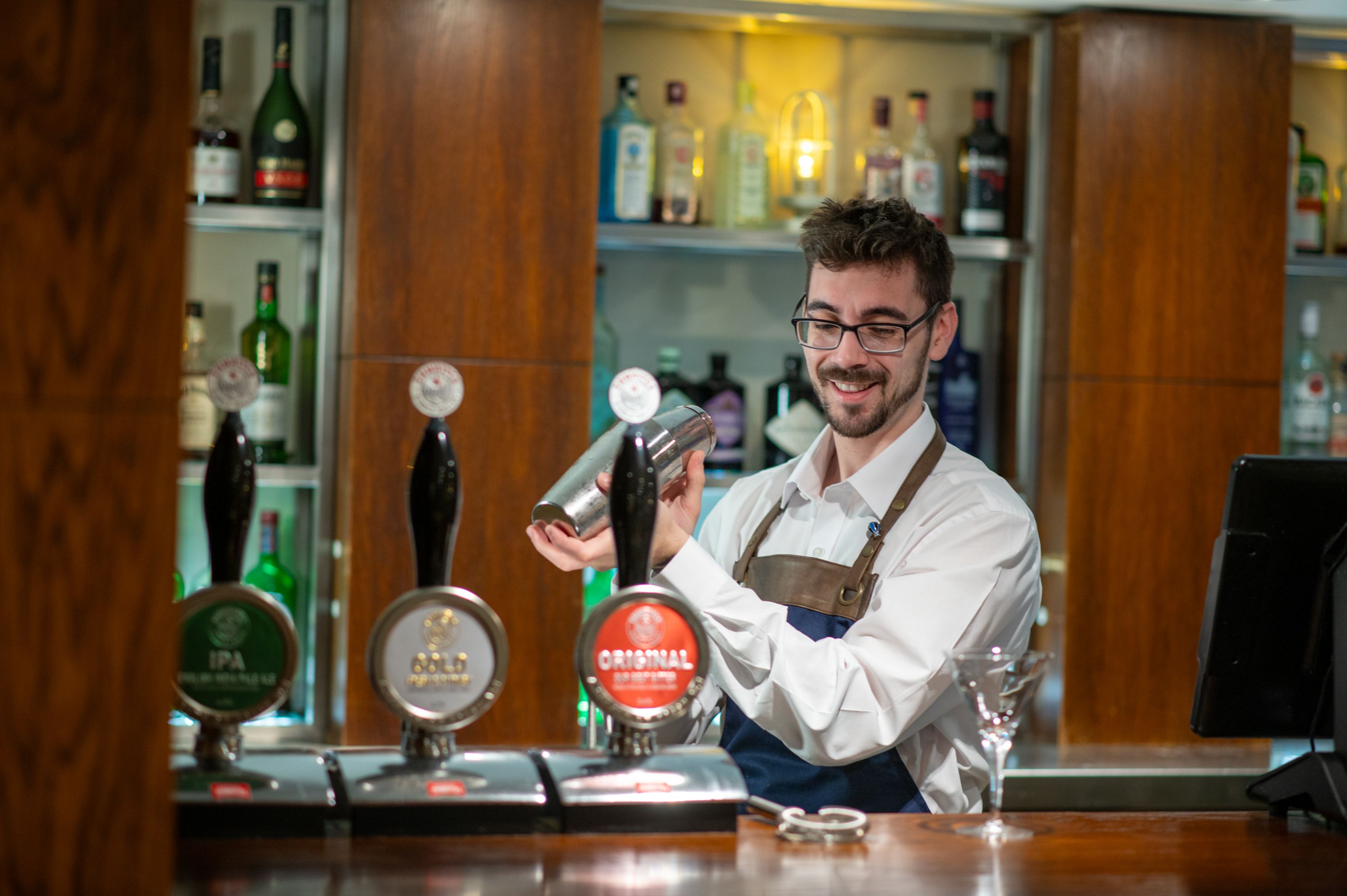 A bartender mixing a drink