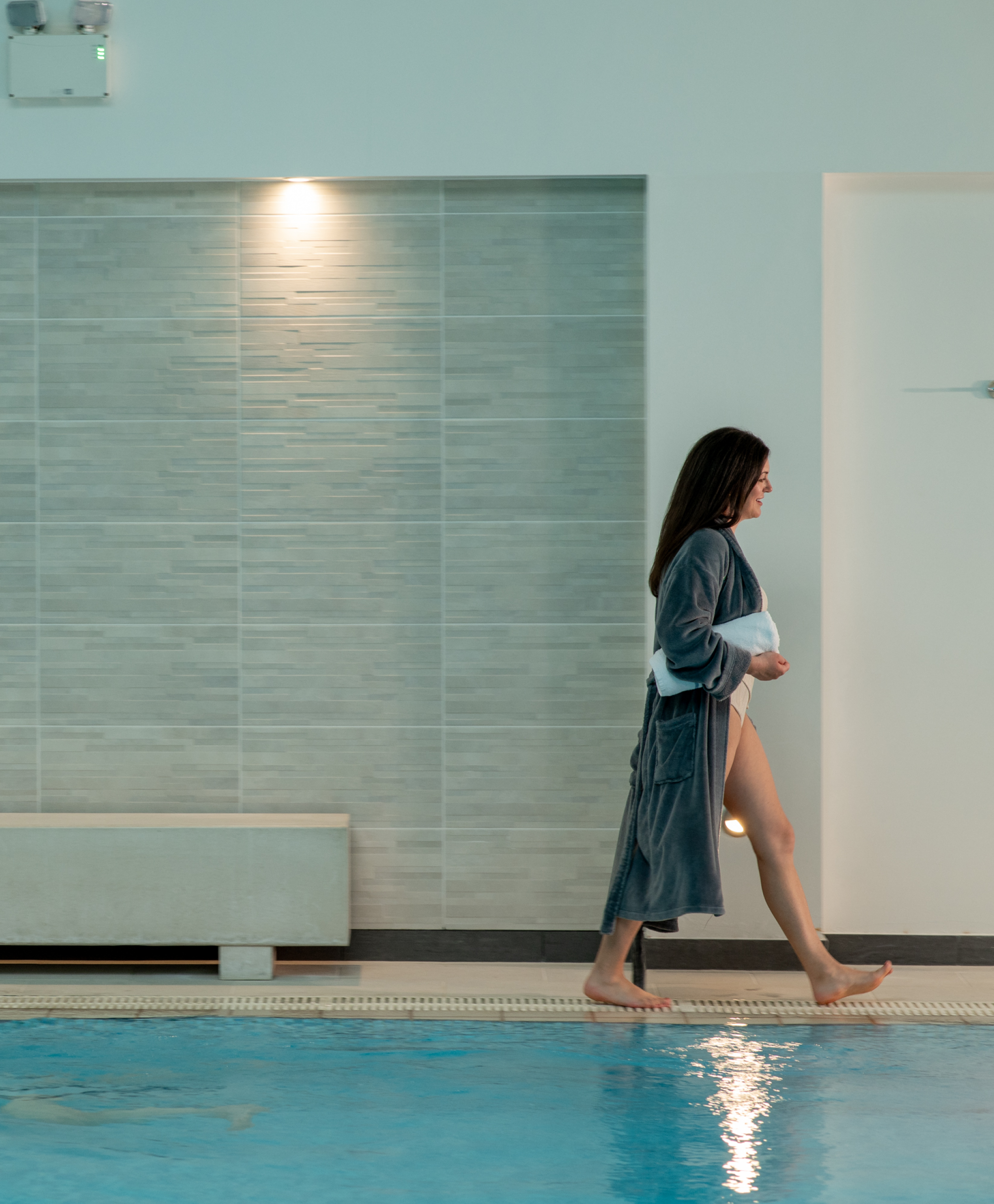 Woman walking by pool