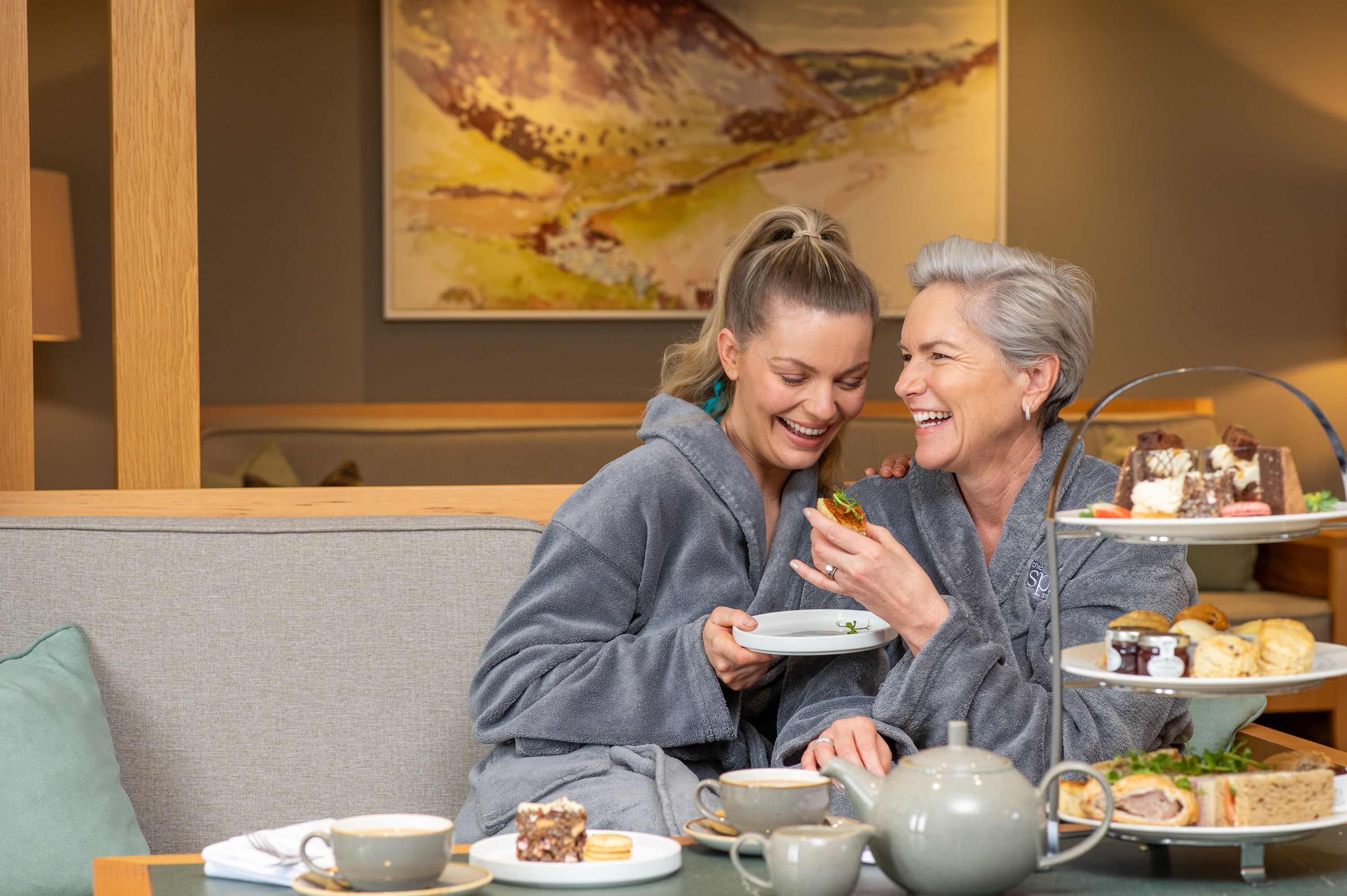 Mother and daughter enjoying afternoon tea