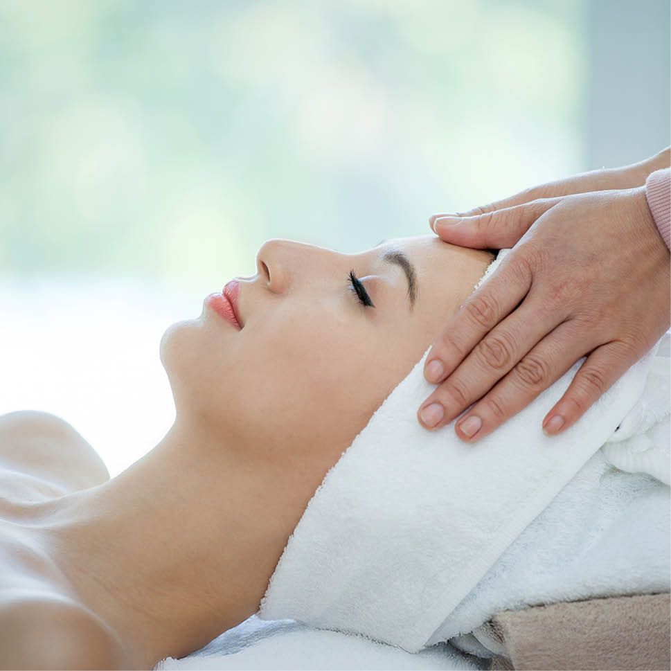 Woman receiving head massage