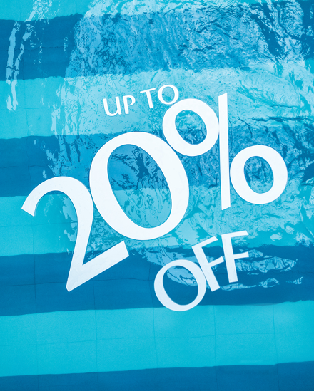 Pool with floats that read "Up to 20% off"